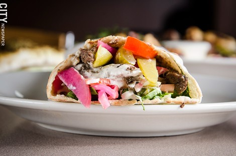 Beef Shawarma (pita bread with tomato, sumac spice, pickled turnips, and cucumbers with tahini sauce) - PHOTO BY MARK CHAMBERLIN