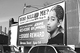 DEE KASZUBA - Billboard on South Clinton pleads for information on one of Rochester's killings.