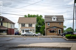 Businesses in converted houses sit across from big-box stores along some sections of East Ridge Road in Irondequoit. - PHOTO BY MARK CHAMBERLIN
