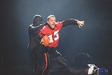 PHOTO BY ANNETTE BROWN - Darren Stevenson (in red) and other members of PUSH Physical Theatre perform a Super Bowl-inspired routine on TruTV's "Fake Off."
