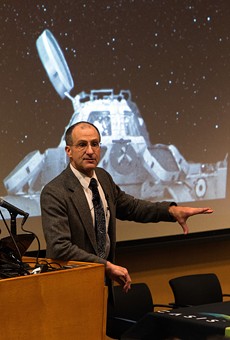 Don Pettit giving a lecture about photography in space.