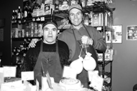 Feta accompli: Vince Giordano (right) and brother-in-law - Tony Grugnale continue to grow their international - cheese shop at the Public Market. - FRANK DE BLASE