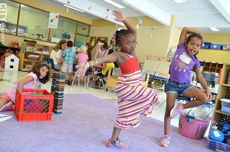 Gloria Milosevic (with blocks), Jahlyse Quick, and Kimoni Quamina have completed the city school district's prekindergarten&#10;program at Rochester Childfirst Network, 941 South Avenue. They will enter kindergarten this school year. - PHOTO BY MATT DETURCK