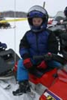 Kids take a break from the races at a Webster Ridge Runners snowmobiling event.