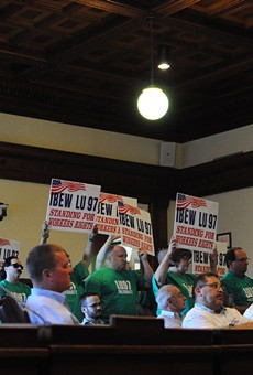 Members of IBEW Local 97 stand while one of the union's members speaks in favor of a support agreement for the Ginna nuclear plant.