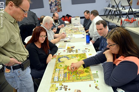 Members of the Rochester Boardgaming Society play a round of Tzolk'in: The Mayan Calendar. - PHOTO BY MATT DETURCK