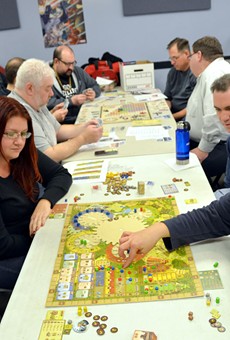 Members of the Rochester Boardgaming Society play a round of Tzolk'in: The Mayan Calendar.