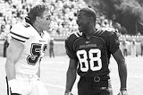 PARAMOUNT PICTURES - More than just team vs. team: Bill Romanowski and Michael Irvin in The Longest Yard.