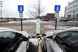 The parking lot outside of the sustainability institute's building has two electric vehicle charging stations. - PHOTO BY JEREMY MOULE