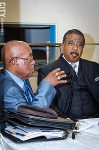 Rev. Willie Harvey and Bishop Jerry McCullough discuss Rochester schools and students. - PHOTO BY: MARK CHAMBERLIN