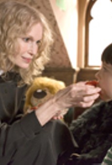 Satan's little helper: Mia Farrow (with Seamus
    Davey-Fitzpatrick) plays the nanny from hell in "The Omen."