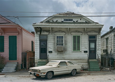 After the floods receeded, watermarks stain a car and houses in post-Katrina New Orleans. This photograph is part of "Robert Polidori: Chronophagia," which is on view at the Memorial Art Gallery through July 24. - PHOTO PROVIDED