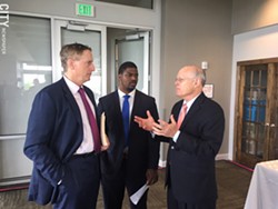 Greater Rochester Chamber of Commerce CEO Bob Duffy, left, and Adrian Hale, the Chamber's workforce and economic development manager, talk with charter school advocate David Osborne during a break at a conference Thursday. - PHOTO BY TIM LOUIS MACALUSO