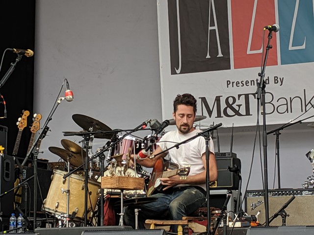 One-man-band  Matt Lorenz, performing under the moniker The Suitcase Junket, to the Midtown Stage on Parcel 5 on Friday, June 28. - PHOTO BY DANIEL J. KUSHNER