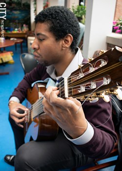 Classical guitarist Michael Anthony Jones performs at Strong Hospital. - PHOTO BY RENÉE HEININGER