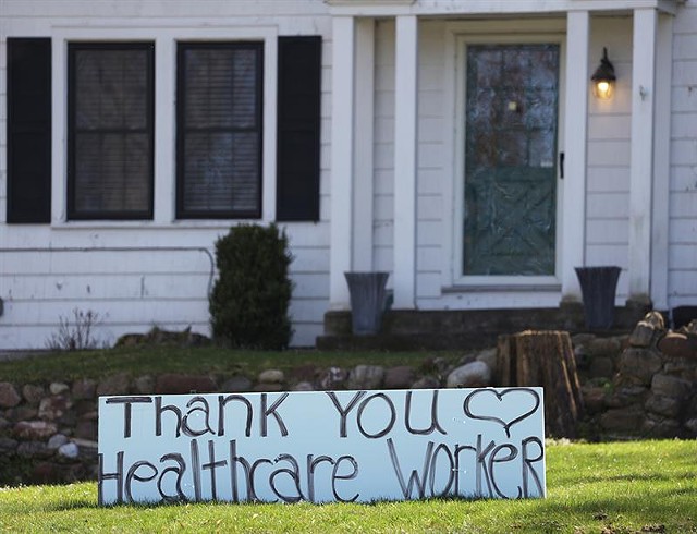 A sign thanking health care workers outside a home in Brighton - PHOTO BY MAX SCHULTE