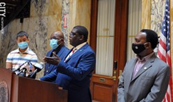Vince Felder, Democratic minority leader of the County Legislature, defends elections commissioners LaShana Boose and Lisa Nicolay during a news conference following a troubled primary election day. Standing with him are, from left, county legislators Calvin Lee, Ernest Flagler-Mitchell, and Frank Keophetlasy. - PHOTO BY JEREMY MOULE