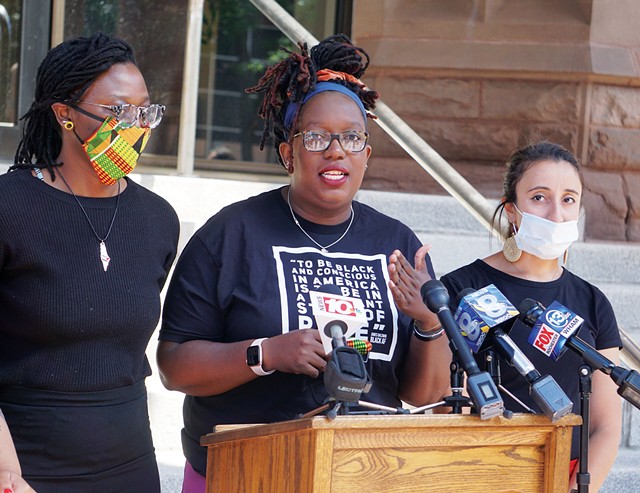 Free the People Roc's Stanley Martin, left, Ashley Gantt, center, and Iman Abid, right, called for the Rochester City Council to defund the Rochester Police Department during a news conference in June. - PHOTO BY GINO FANELLI