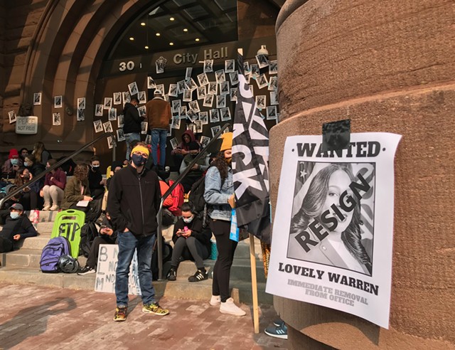 Protesters plastered City Hall in September 2020 with posters calling for Mayor Lovely Warren's resignation. - PHOTO BY DAVID ANDREATTA