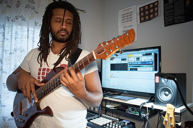 Phillip Coleman, a.k.a. GodClouD, at work in his home studio in Rochester. - PHOTO BY JACOB WALSH