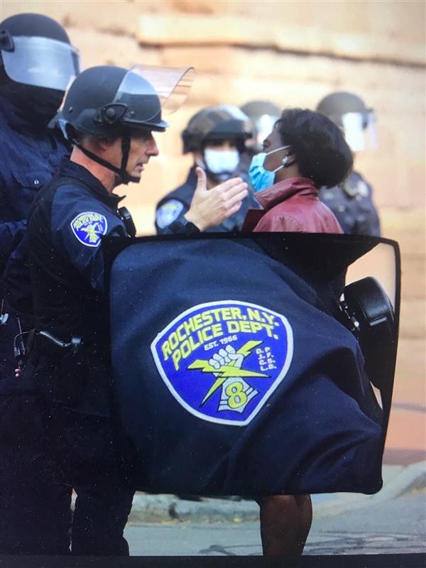Rochester Police Department Capt. Ray Dearcop speaks with the Rev. Myra Brown during a protest outside City Hall on Sept. 16, 2020. - PHOTO ILLUSTRATION BY MAX SCHULTE