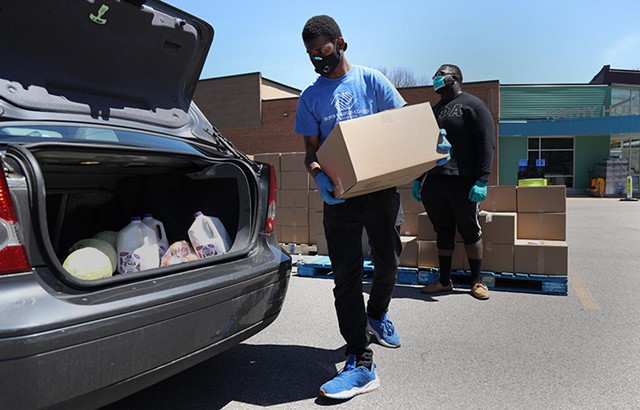 An emergency food distribution on Genesee Street, run by Foodlink in May 2020. - PHOTO BY MAX SCHULTE / WXXI NEWS