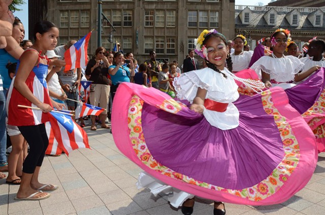 A young girl dances at the Puerto Rican Festival parade. - FILE PHOTO
