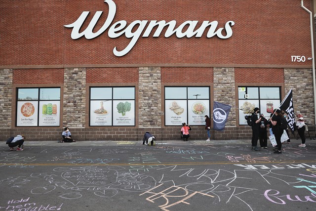 Black Lives Matter activists protested in front of Wegmans on East Avenue in Rochester on March 23 to mark the one-year anniversary of Daniel Prude's fatal encounter with city police. - PHOTO BY MAX SCHULTE
