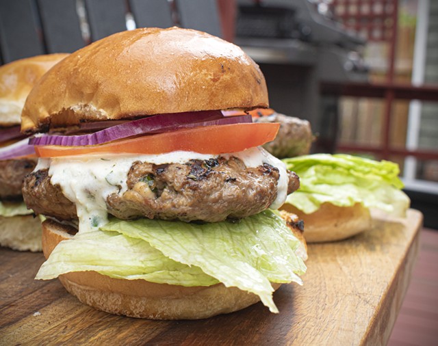 Crumbled feta cheese mixed into the patties really makes these lamb burgers pop. - PHOTO BY JACOB WALSH