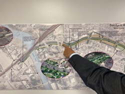 A man points at concept five for the Inner Loop. - PHOTO PROVIDED BY CITY OF ROCHESTER
