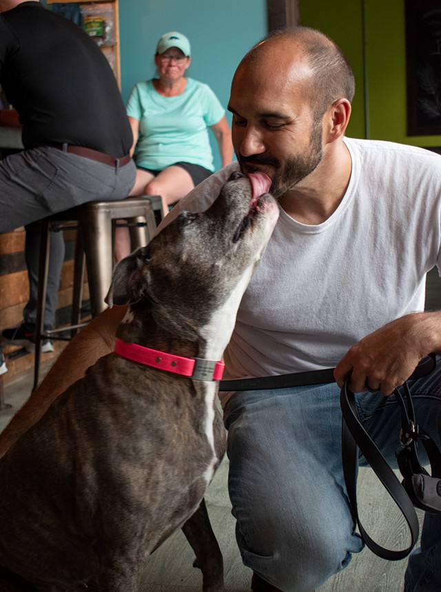 Brindle Haus owner John Boothe and his dog, Mia. - PHOTO BY JACOB WALSH