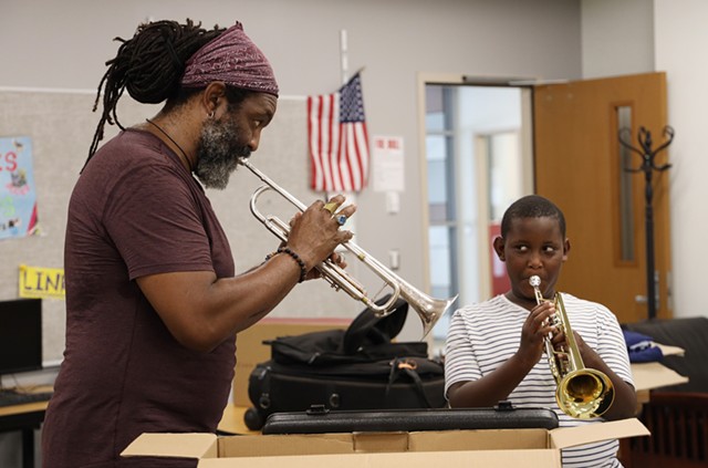 Herb Smith and 10-year-old Cameron Terry play together during a Herb's City Trumpets lesson. - PHOTO BY MAX SCHULTE / WXXI NEWS
