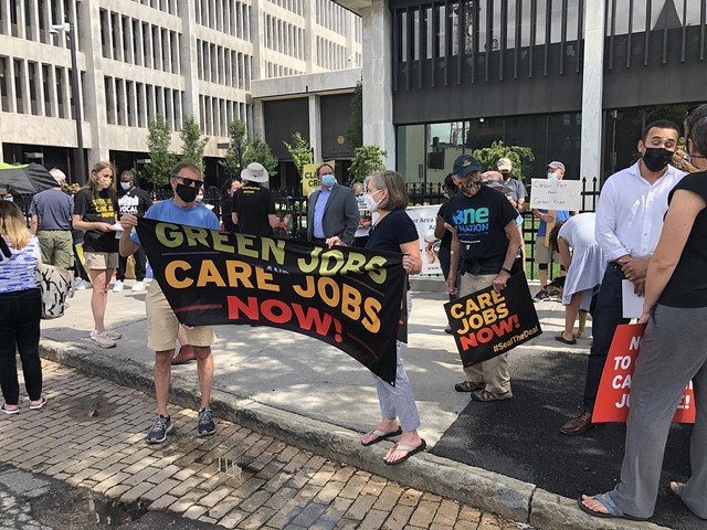A few dozen supporters of federal legislation to fund climate, health care, education and other initiative gathered Thursday in front of the Federal Office Building on State St. in Rochester - PHOTO COURTESY RANDY GORBMAN / WXXI NEWS