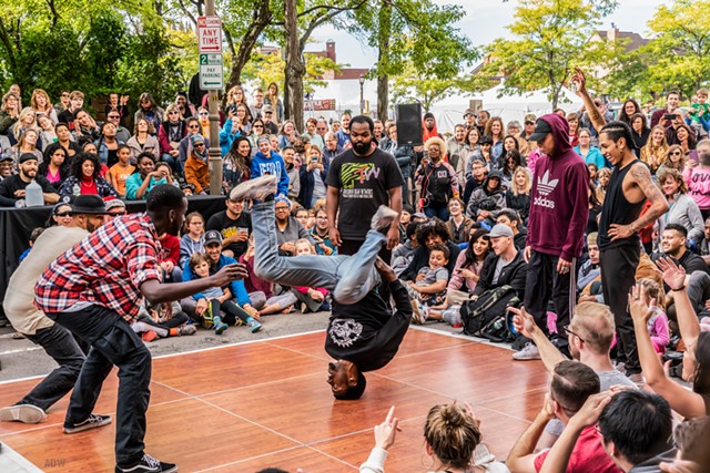 A B-boy performs as other dancers look on at Fringe Street Beat as part of the 2018 Rochester Fringe Festival. - PHOTO BY AARON WINTERS