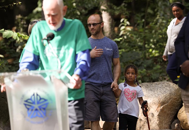 Robert Allen and his daughter, Kaylee Allen, stumble into a press conference after hiking in Washington Grove. - PHOTO BY MAX SCHULTE / WXXI NEWS