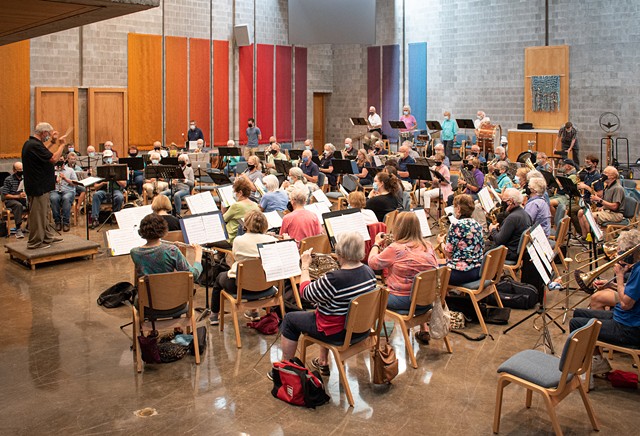 Larry Neeck conducts the New Horizons Concert Band and Symphonic Band in a rehearsal for its 30th anniversary concert on Oct. 29, 2021. - PHOTO BY JACOB WALSH