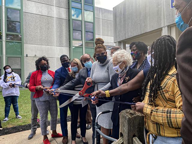 Surrounded by students and school and city officials, Dr. Alice Holloway Young takes part in Wednesday's ceremony renaming School 3 in her honor. - PHOTO BY RACQUEL STEPHEN / WXXI NEWS