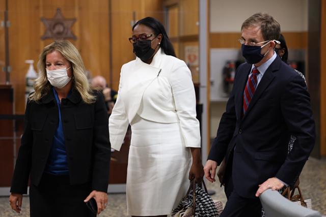 Mayor Lovely Warren enters Monroe County Court on Monday with her attorneys Carrie H. Cohen and Nathan Reilly. Warren's trial on campaign finance charges was scheduled to begin, but she and her co-defendants accepted a plea deal. - PHOTO BY MAX SCHULTE