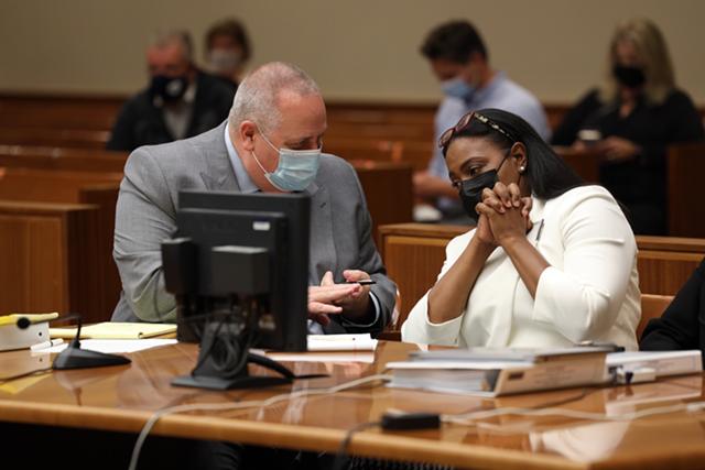 Mayor Lovely Warren confers with her primary attorney, Joe Damelio, in court, where she accepted a plea deal. - PHOTO BY MAX SCHULTE