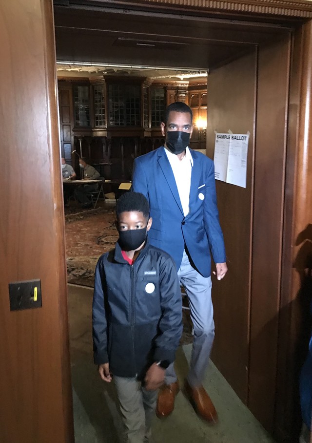Malik Evans, the presumptive mayor-elect of Rochester, cast his ballot on Nov. 2, 2021, with his 10-year-old son, Cameron, in tow. - PHOTO BY DAVID ANDREATTA