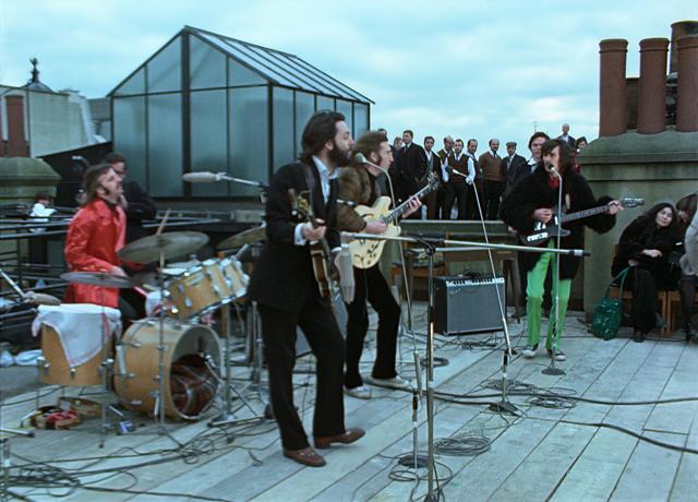 The Beatles perform during their famous rooftop concert on Jan. 30, 1969, in London. - PHOTO BY APPLE CORPS LTD.