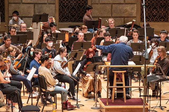 The Eastman Philharmonia, led by Neil Varon, rehearses "The Brightness of Light" for the Oct. 1 centennial performance. - PHOTO BY JACOB WALSH
