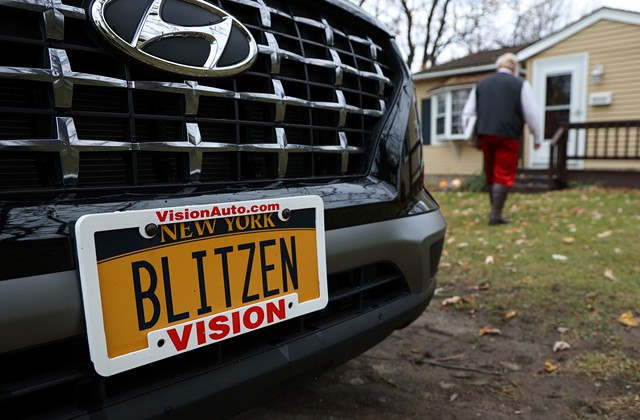 When he's not traveling on his magical sleigh, Mike Ihrig gets around in a subcompact SUV with a "BLITZEN" license plate. - PHOTO BY MAX SCHULTE