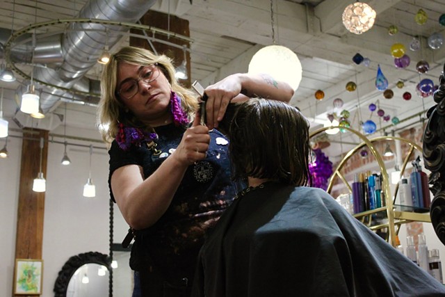 Gallery Salon owner and stylist Erika Sorbello gives a customer a cut. - PHOTO BY WHITNEY YOUNG