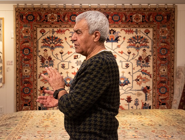 Reza Sattari, owner of Oriental Rug Mart at Eastview Mall, got his start in the rug business on East Avenue, where he opened his first shop in 1990. - PHOTO BY JACOB WALSH