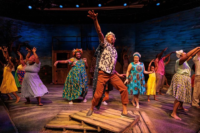 Cameron Tyson (center) as the river god Agwe with the ensemble cast of "Once on This Island." - PHOTO BY RON HEERKENS JR./GOAT FACTORY MEDIA