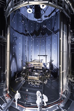 Aerial view of engineers preparing NASA's space simulation chamber for massive tests. - PHOTO PROVIDED.