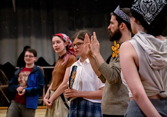 Madeleine Fordham, Edward Byrne and other Rochester Community Players actors rehearse a wedding scene in "Pericles, Prince of Tyre" with large cardboard-cutout props. - JACOB WALSH