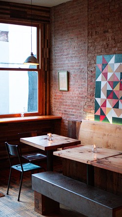 Sunlight from Linden Street pours into Microclimate’s front windows, with a view of the restaurant’s outdoor seating - PETE WAYNER.