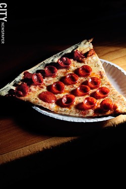 A slice of Acme's beloved cup 'n' char pizza. - FILE PHOTO